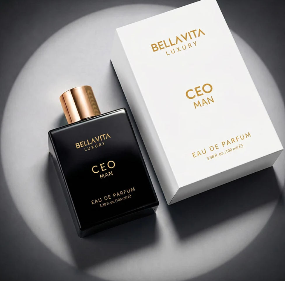 Bellavita CEO Man black perfume bottle with a gold cap beside a white CEO Man box, arranged diagonally in a circular spotlight on gray.
