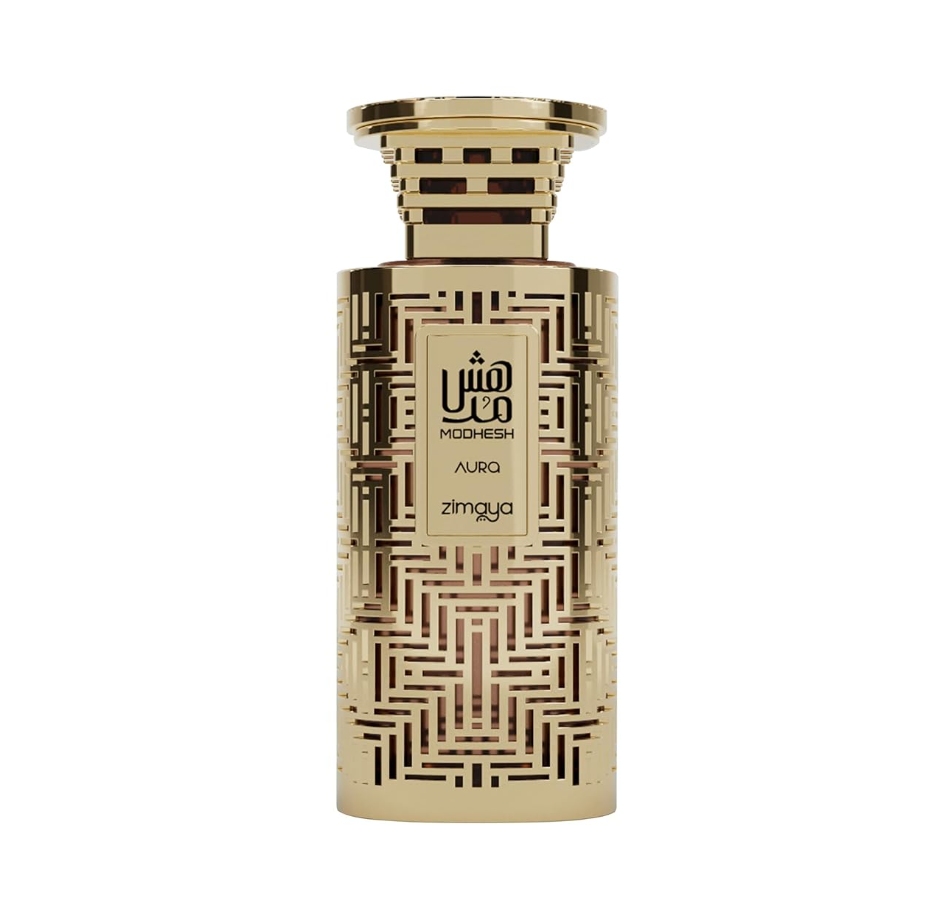 Zimaya Modhesh Aura gold cylindrical bottle with dark maze-like geometric pattern, rectangular front label and flared gold-and-dark striped cap, isolated on white.