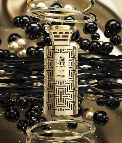 Zimaya Modhesh Aura patterned gold bottle amid floating gold rings and black-and-gold spheres, above a glossy black geometric surface.