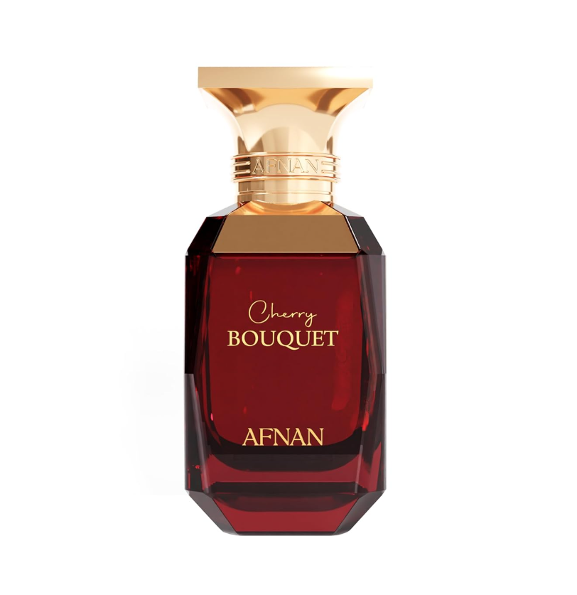 Afnan Cherry Bouquet dark red faceted glass bottle with gold shoulders, broad flared gold cap and gold front lettering, isolated on white.