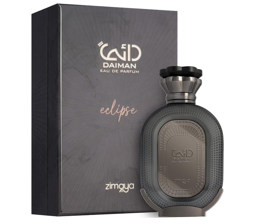 Zimaya Daiman Eclipse dark oval perfume bottle with textured border, metallic front plaque and flared black-and-gray cap, beside its charcoal box on white.