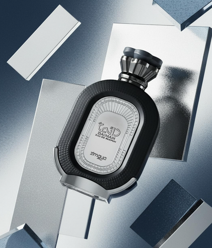 Zimaya Daiman Eclipse dark oval bottle tilted among angular silver and blue-gray panels, with its silver front plaque and textured black border visible.