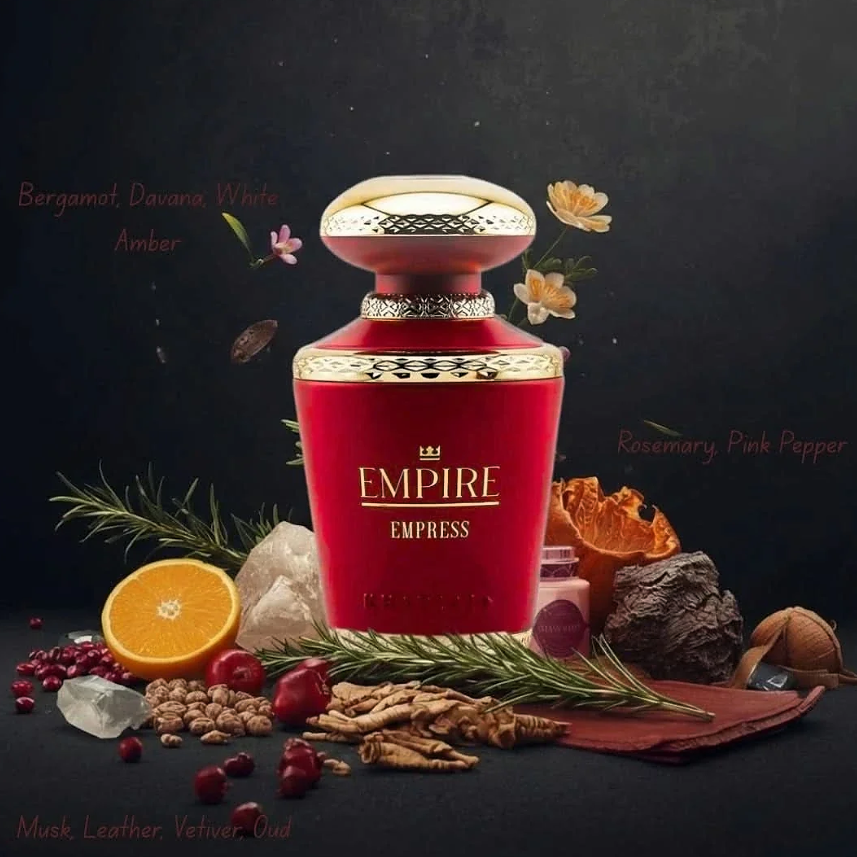 Khadlaj Empire Empress bottle with citrus, herbs, spice and wood-inspired props on a dark background