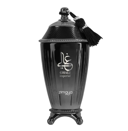 Zimaya Ghali Imperial fluted black bottle with silver lettering, textured domed black cap, black tassel and ornate dark footed base, isolated on white.