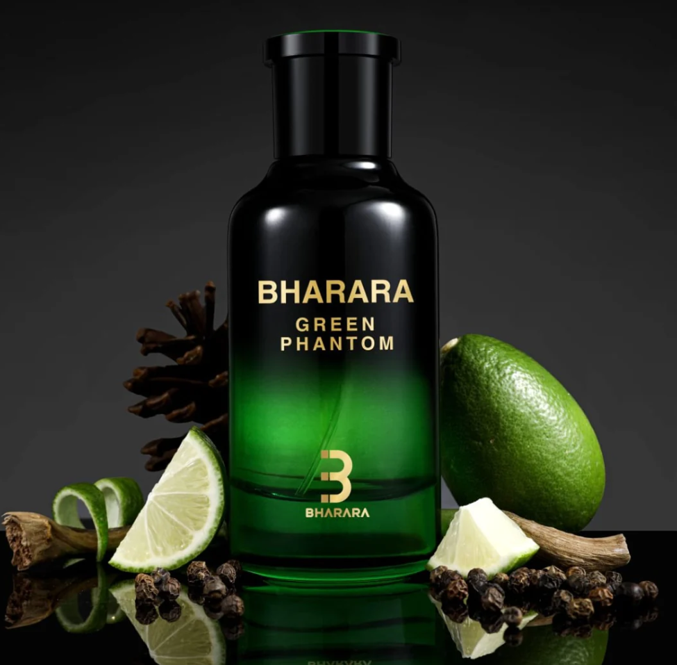 Bharara Green Phantom black-and-green bottle with a black cap and gold lettering among lime wedges, a whole lime, dark peppercorns and wood pieces against a dark background.