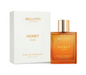 Bellavita Honey Oud clear rectangular bottle filled with amber-colored perfume, topped with a gold cap, beside its white and gold box on white.