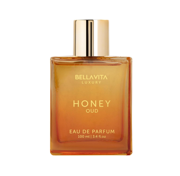 Front view of Bellavita Luxury Honey Oud 100ml perfume in an amber glass bottle with a gold cylindrical cap and pale gold lettering on white.