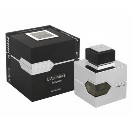 Al Haramain L'Aventure Intense silver square perfume bottle with an angular amber window and black cap beside a black box with silver detailing on white.