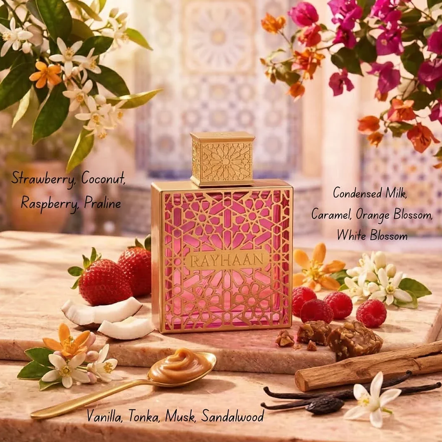 Rayhaan Kiss bottle surrounded by berries, coconut, flowers and caramel-inspired props