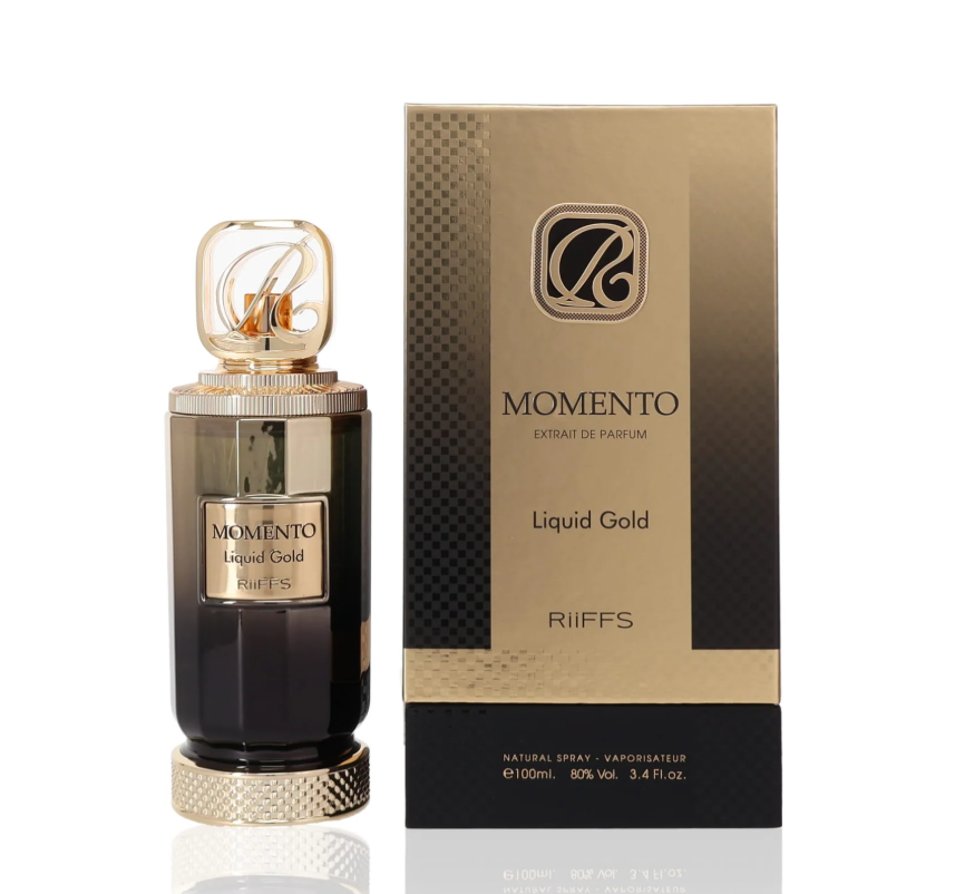 Riiffs Momento Liquid Gold dark faceted perfume bottle with gold label, textured gold base and openwork monogram cap, beside its gold-and-black box on white.