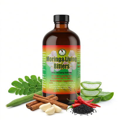 African Indian Herbs Moringa Living Bitters bottle in an arrangement of leaves, roots and spice props