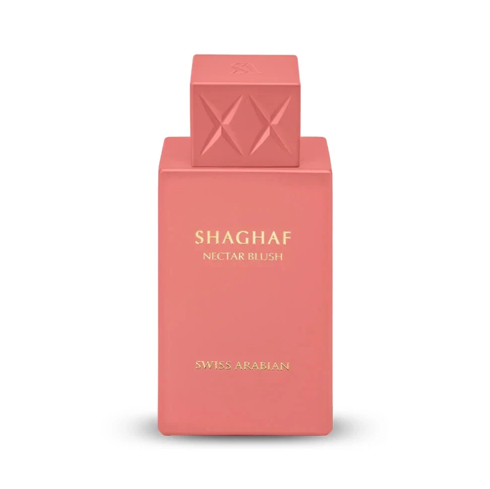 Swiss Arabian Shaghaf Nectar Blush coral-pink bottle with gold lettering and square cap embossed with two crossed diamond motifs, isolated on white.
