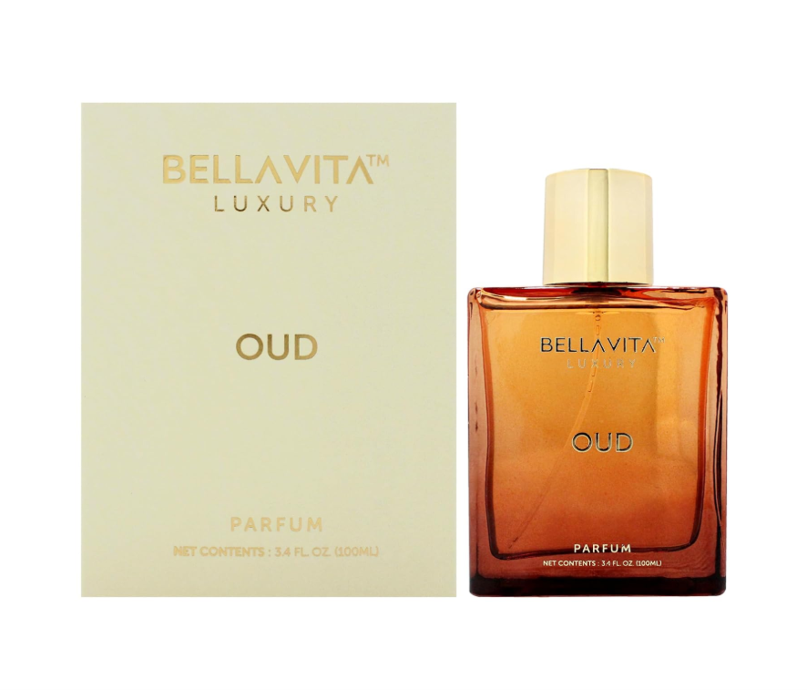 Bellavita Luxury Oud Parfum amber rectangular bottle with a pale gold cap beside a pale gold box with matching lettering on a white background.