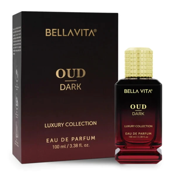 Bellavita Oud Dark black-to-burgundy perfume bottle with a textured gold cap and stepped base beside its matching dark box on white.