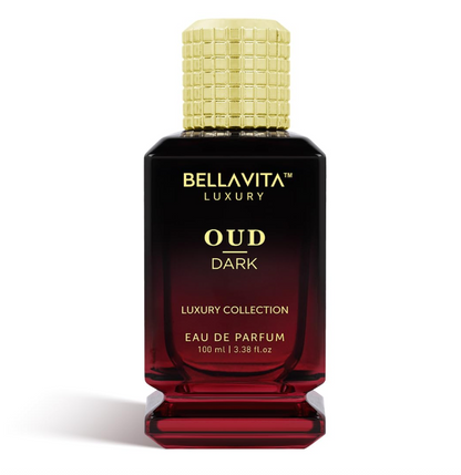 Bellavita Oud Dark bottle with a black-to-red glass gradient, gold lettering, a grid-textured gold cap and a stepped red base on white.