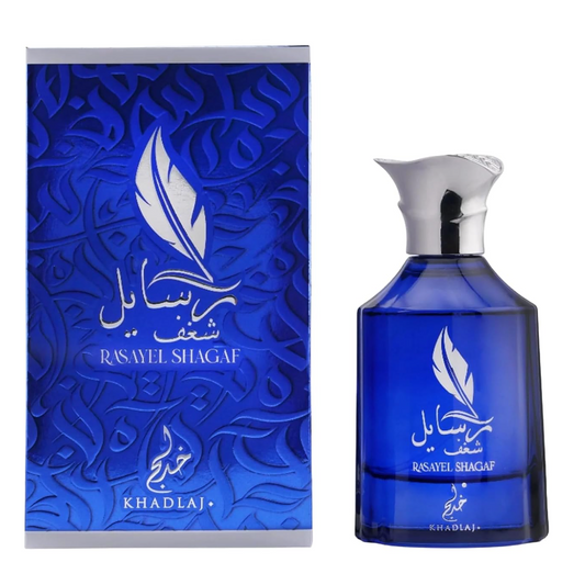 Khadlaj Rasayel Shagaf blue bottle with sculpted silver cap beside a blue feather-pattern box