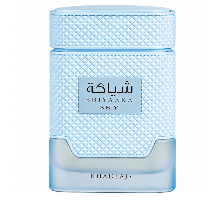 Khadlaj Shiyaaka Sky pale blue bottle with diamond-patterned body and wide cap, silver-blue name plaque and smooth translucent lower section, isolated on white.