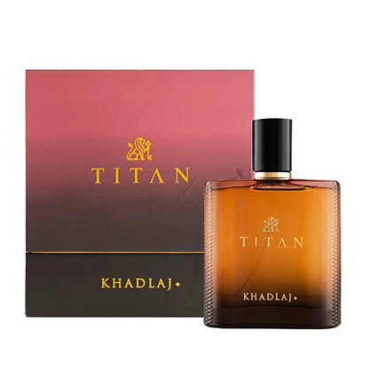 Khadlaj Titan amber gradient bottle with black cap beside its pink and dark gradient box