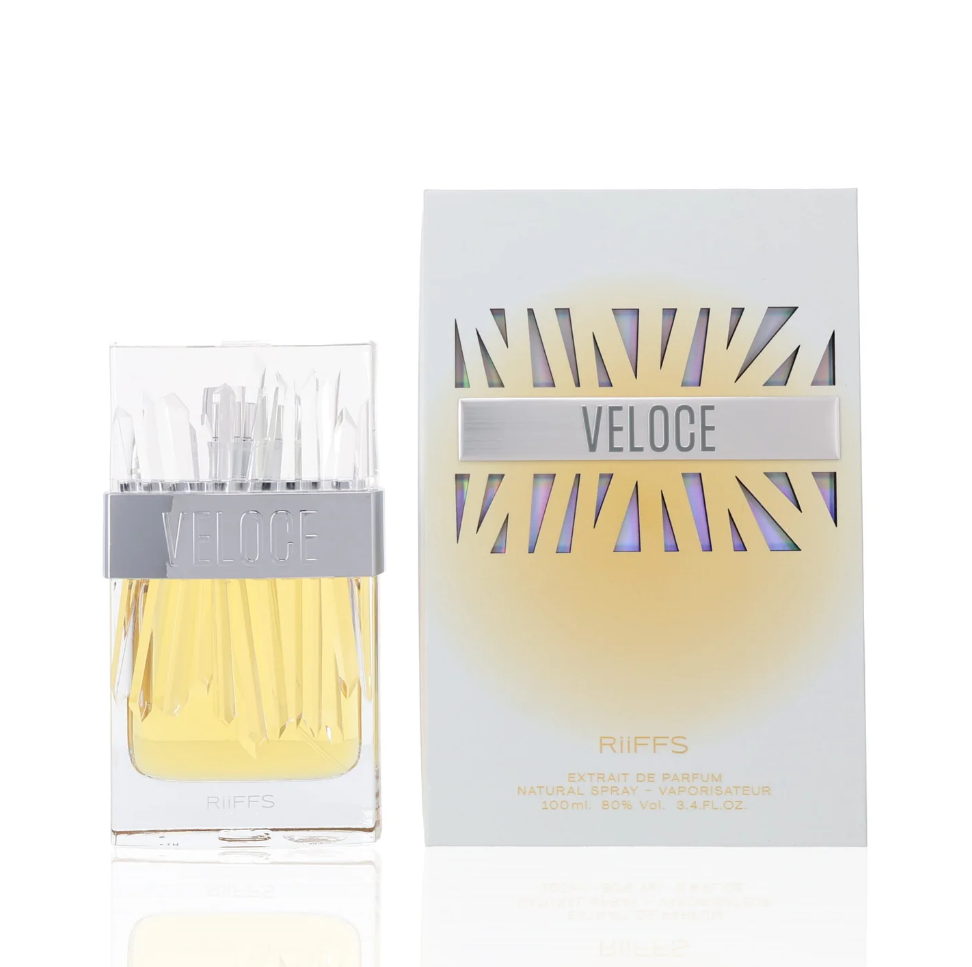 Riiffs Veloce clear rectangular perfume bottle with yellow liquid, faceted clear cap and silver name band, beside a pale box with geometric cutout-style graphics on white.