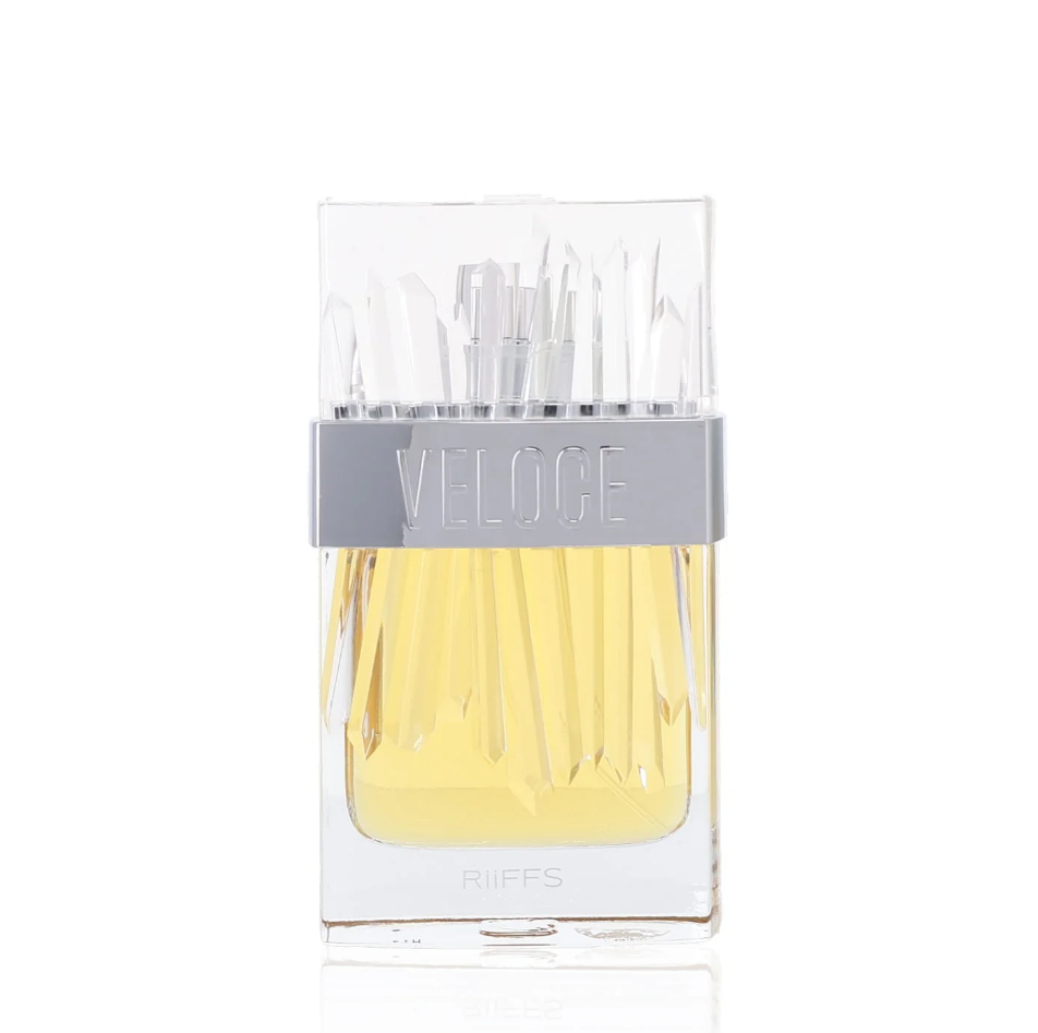 Riiffs Veloce clear perfume bottle with yellow liquid, angular glass detailing, transparent crystal-shaped cap and silver Veloce band, isolated on white.